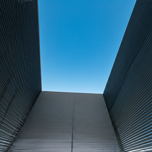 Modern building facade looking up to the sky